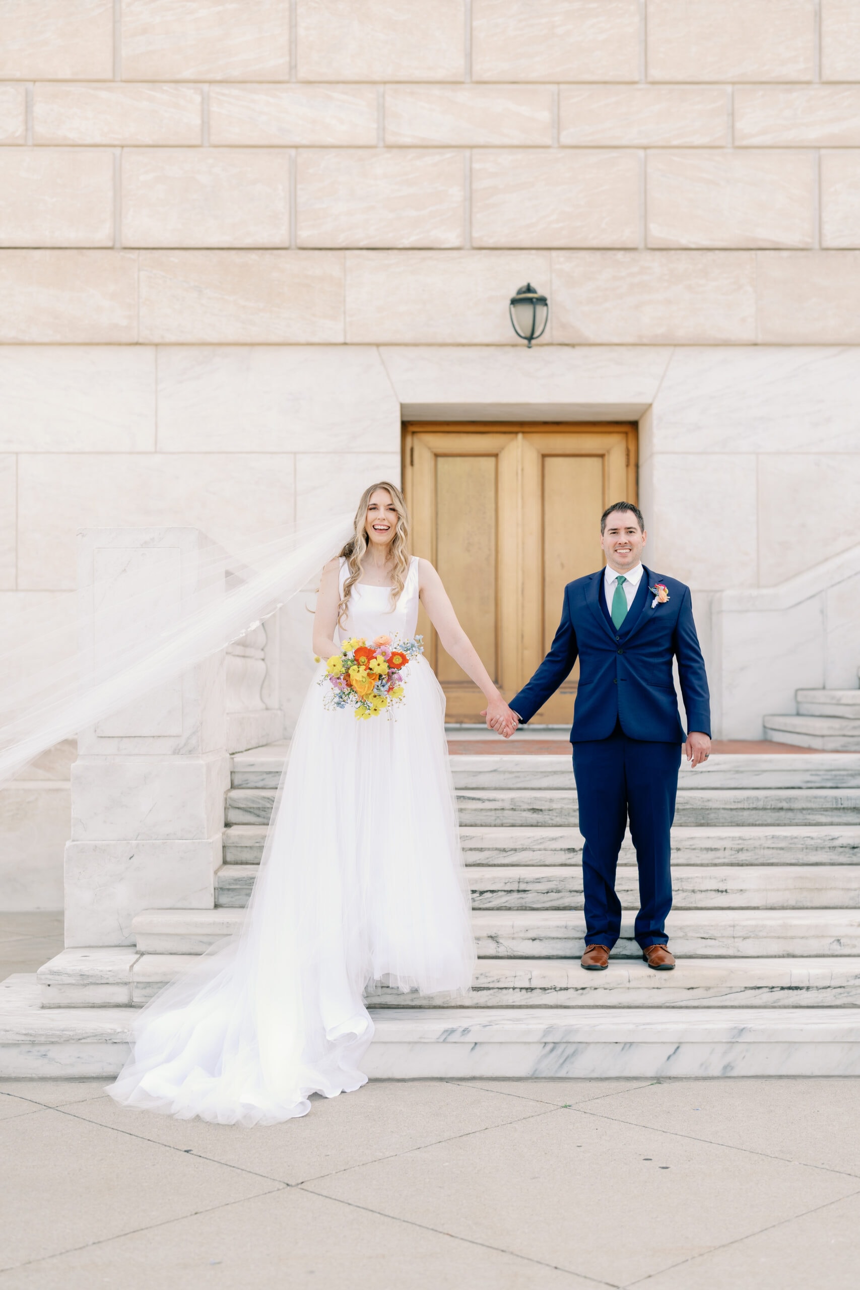 Couture Bride Ashley in Custom Sarah Kolis Gown and veil and groom