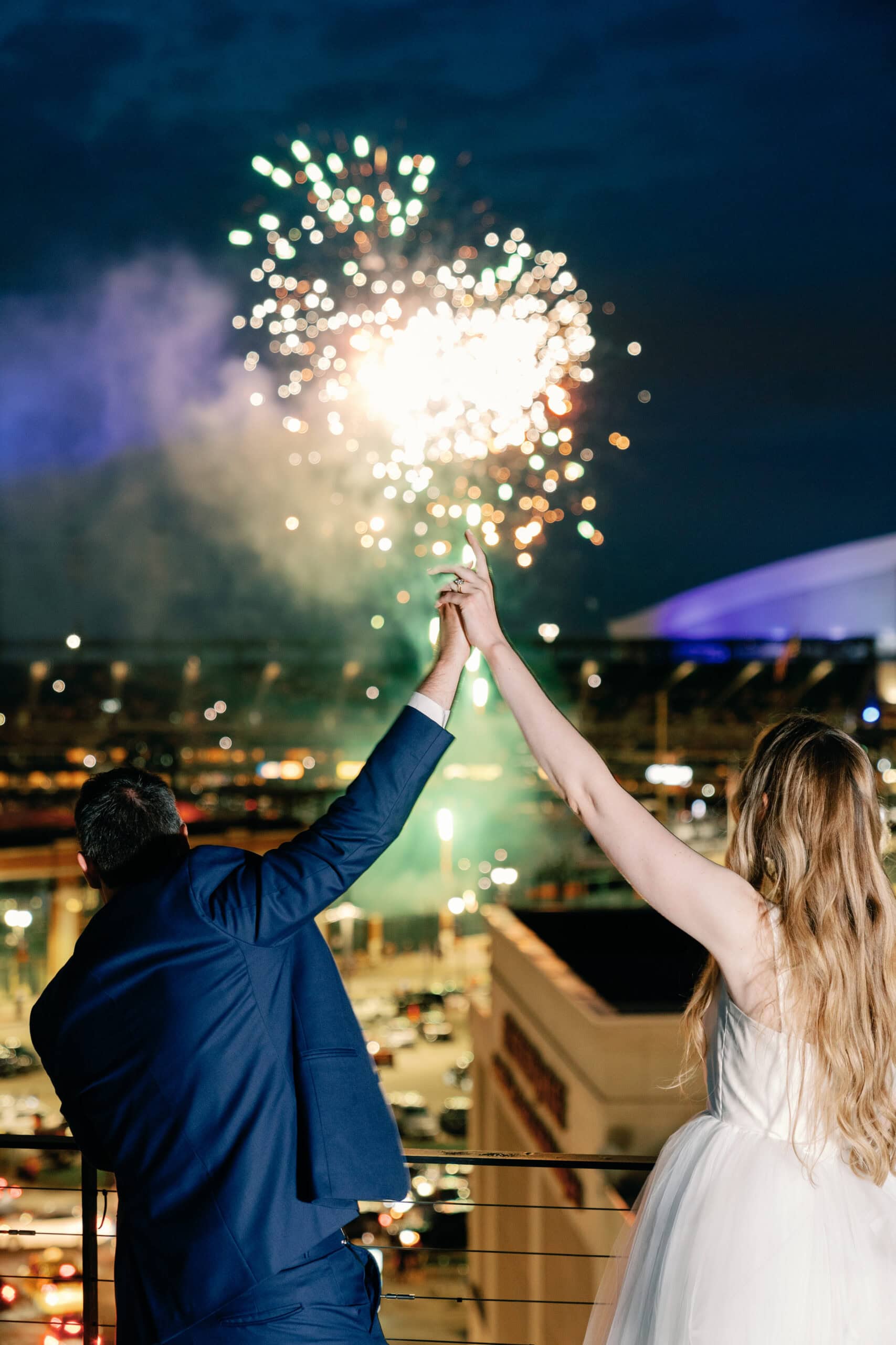 Couture Bride Ashley in Custom Sarah Kolis Gown and veil and groom fireworks