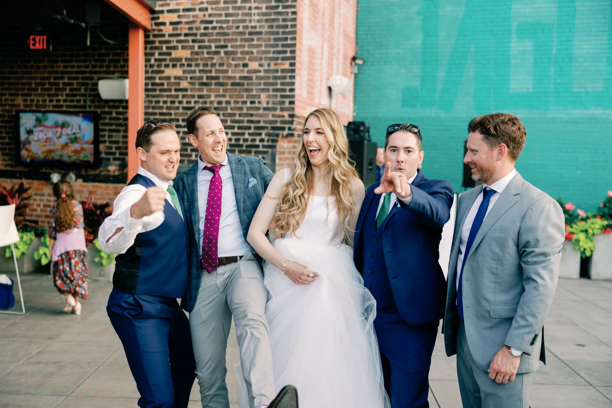 Couture Bride Ashley in Custom Sarah Kolis Gown and veil and groom 