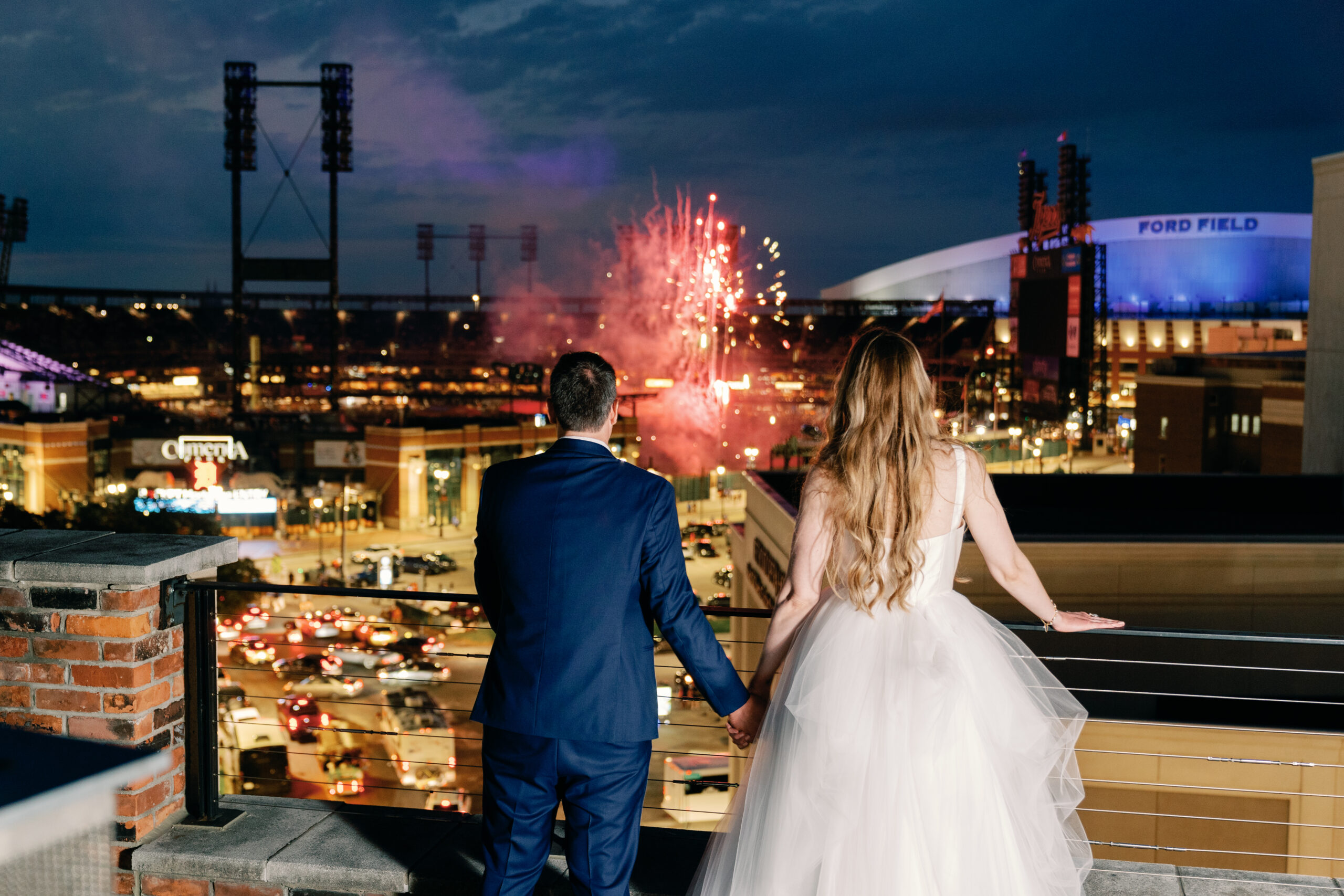 Couture Bride Ashley in Custom Sarah Kolis Gown and veil and groom fireworks