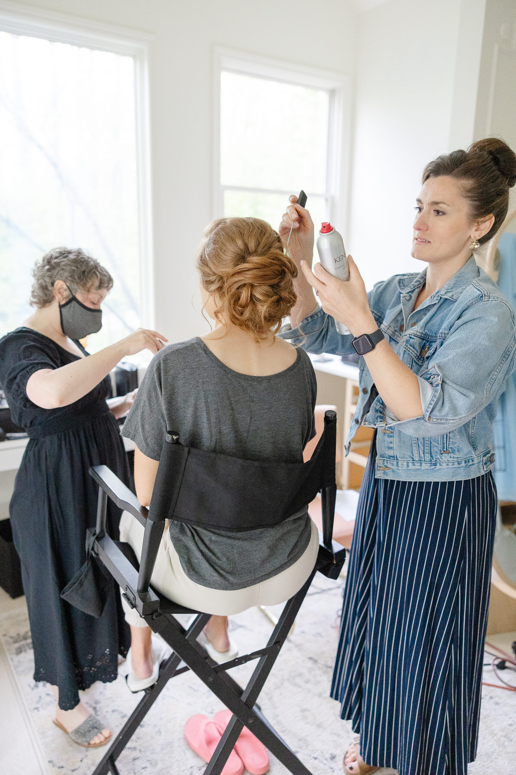 Danielle from DN Artistry and Carleana from Hairpins & Happiness at work on Melissa's hair and makeup