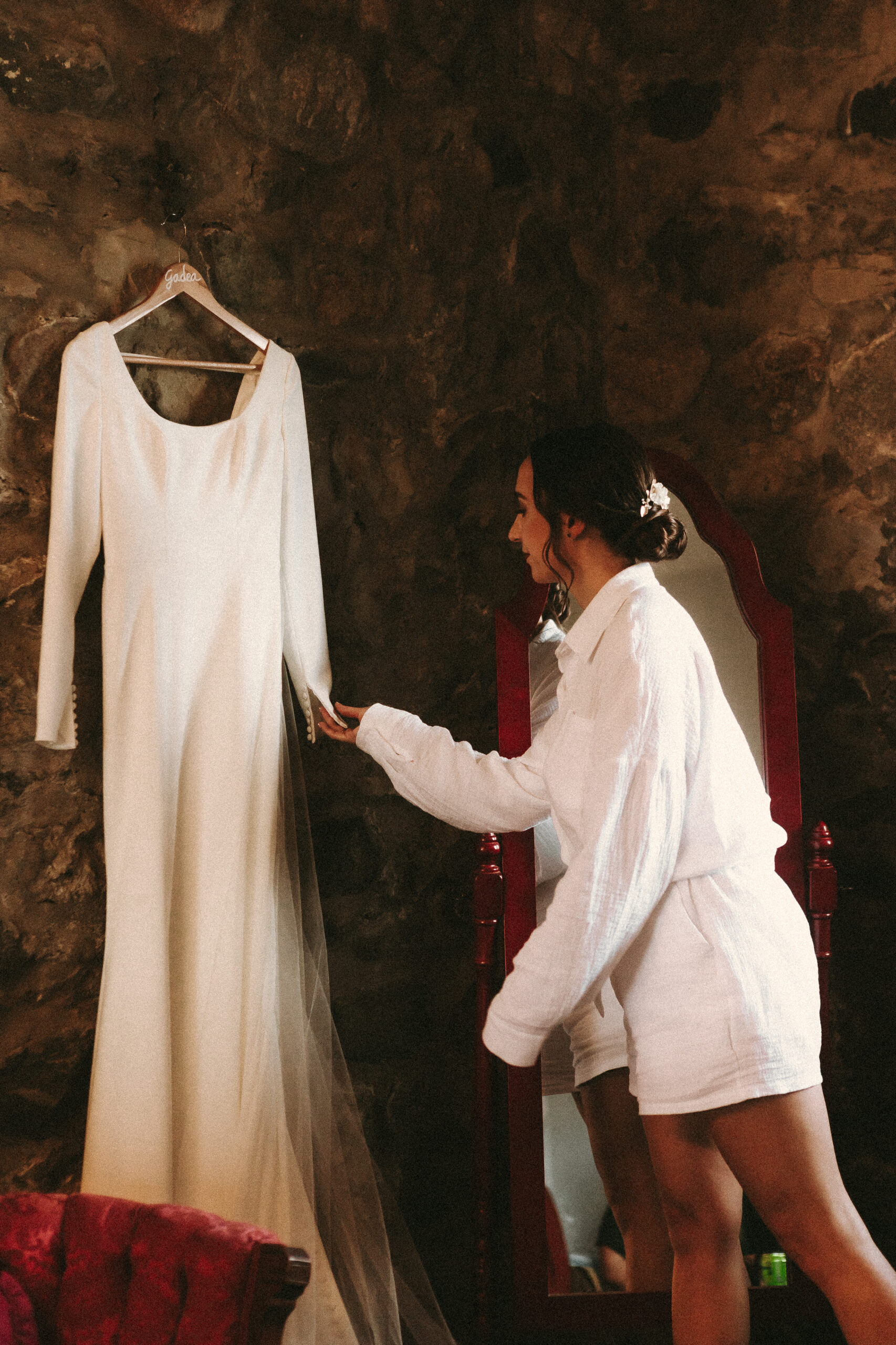 Bride Gadea looking at wedding dress